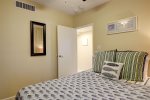 Guest bedroom queen bed and ceiling fan